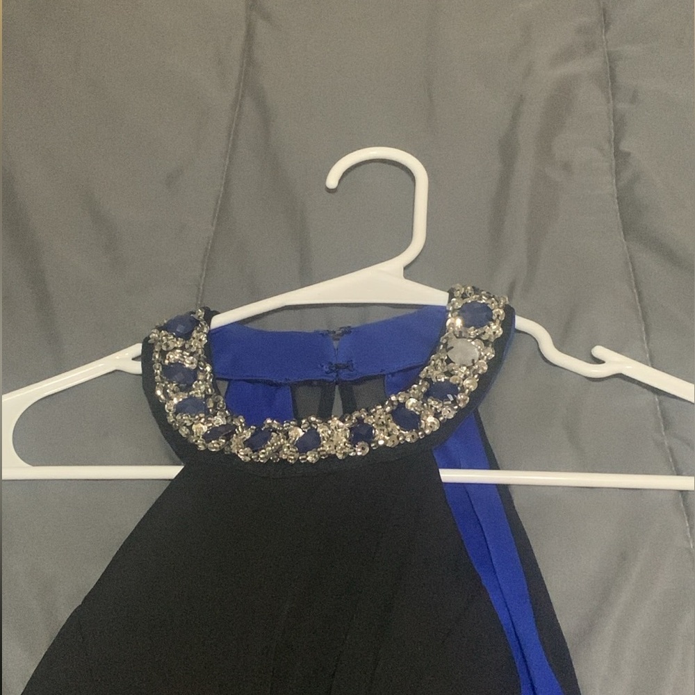 Black halter top dress with royal blue inside and see through sides & open back.
